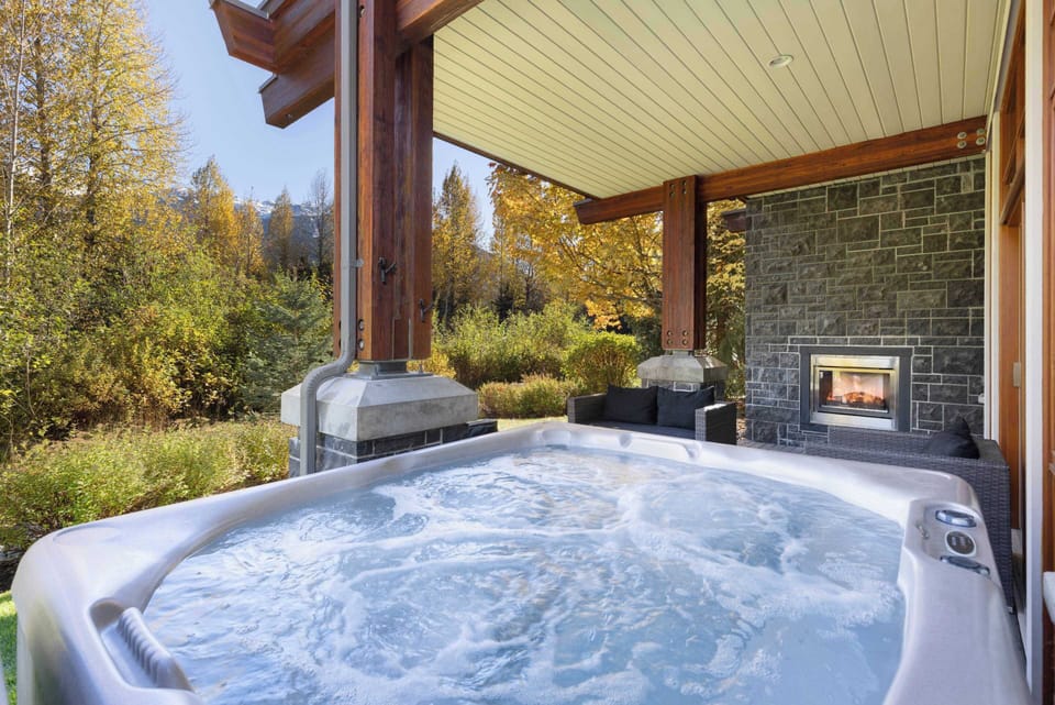 - Private outdoor hot tub overlooking forest and mountain scenery  
- Covered patio lets you enjoy bubbling relaxation in any weather  
- Peaceful nature views create the perfect après-adventure retreat  
