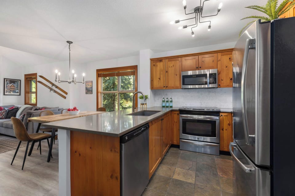 - Modern kitchen with stainless appliances and open counters  
- Easy flow to dining and living spaces for group cooking  
- Bright natural light enhances your stay experience  
