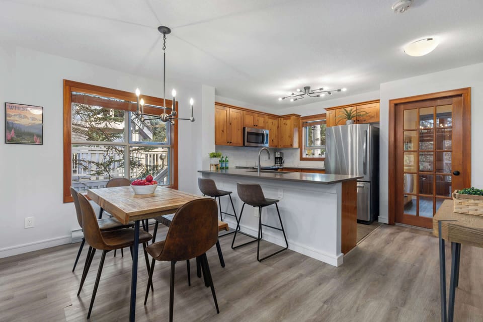 - Spacious dining area set for shared meals and group stays  
- Open layout blends naturally with kitchen and living room  
- Woodland views make every meal feel special  
