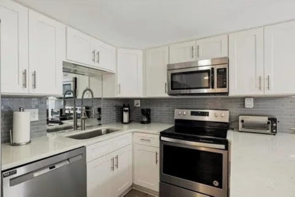 Kitchen with updated cabinets, counter tops and upscale appliances