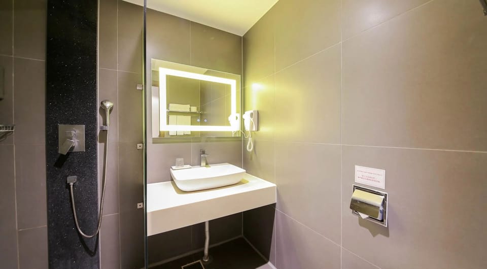 Standard Twin Room | Bathroom | Hair dryer, slippers, towels, soap