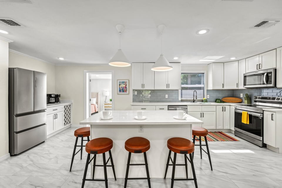 Convenience is key in this thoughtful layout, placing the primary bedroom easily accessible, yet perfectly private.
