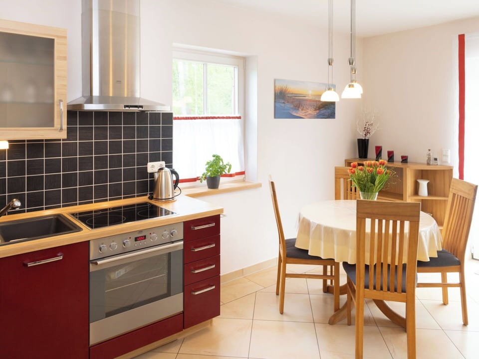 Furniture, Flooring, Kitchen, Interior Design, Kitchen Appliance, Countertop, Cabinetry, Wood, Floor, Chair