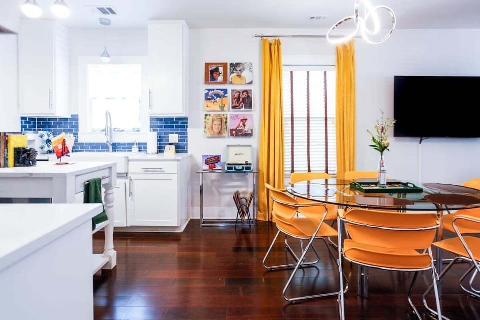 The dining room comfortably seats 6 with a nearby record player to amp up the ambiance.