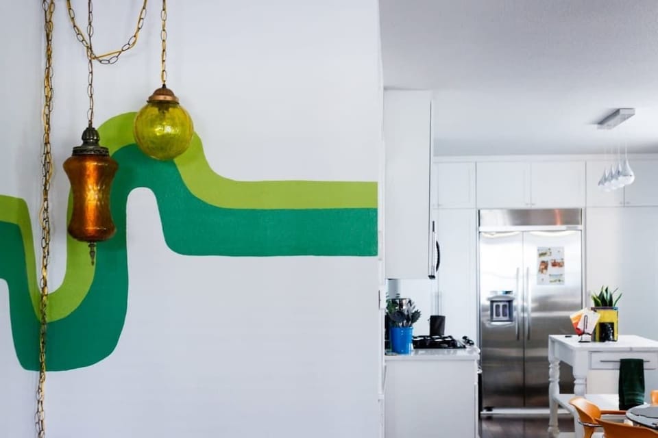 Swag lamps illuminate the space with groovy light patterns.