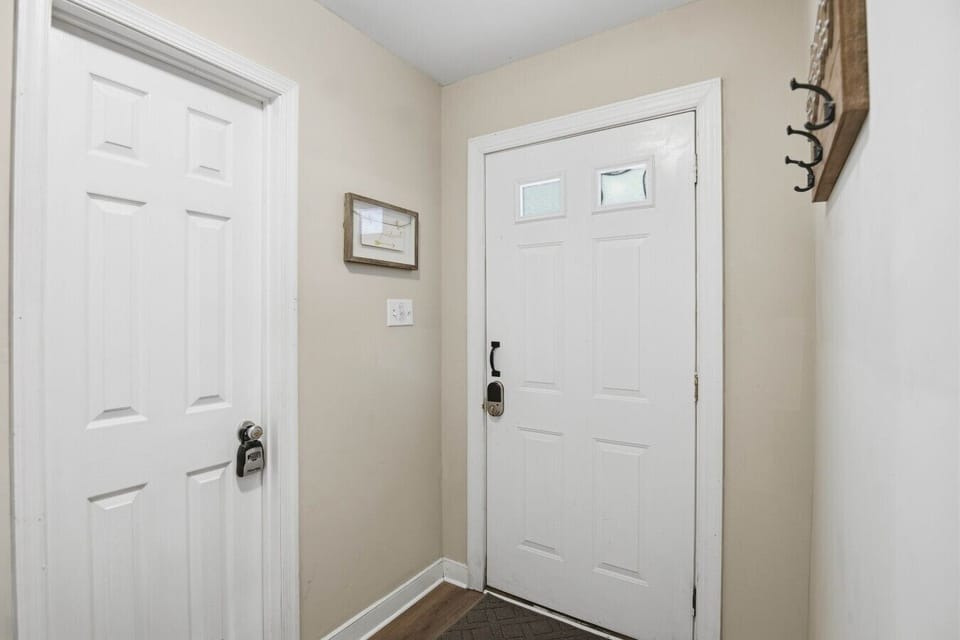 Inviting front entrance with convenient stair access to the upper level.