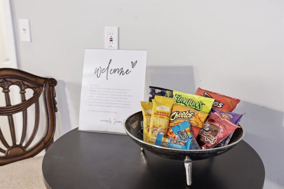 Welcoming entry table featuring a decorative sign and a styled bowl display, adding a warm first impression to the space.