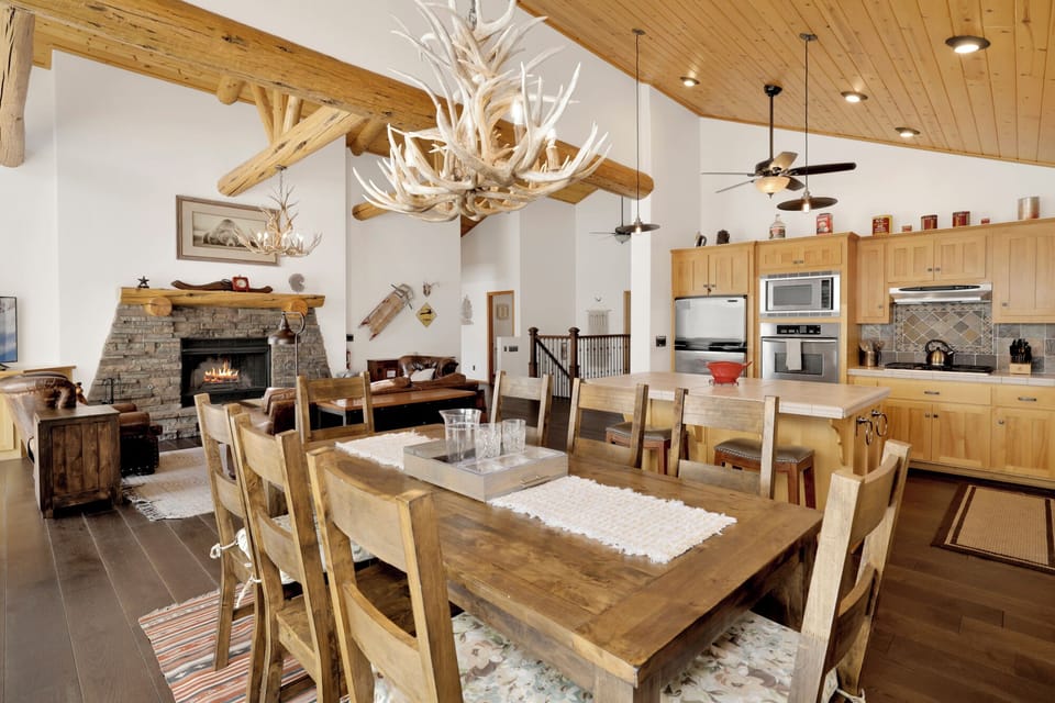 Gather around the dining table, which offers seating for four perfect for meals and game nights.