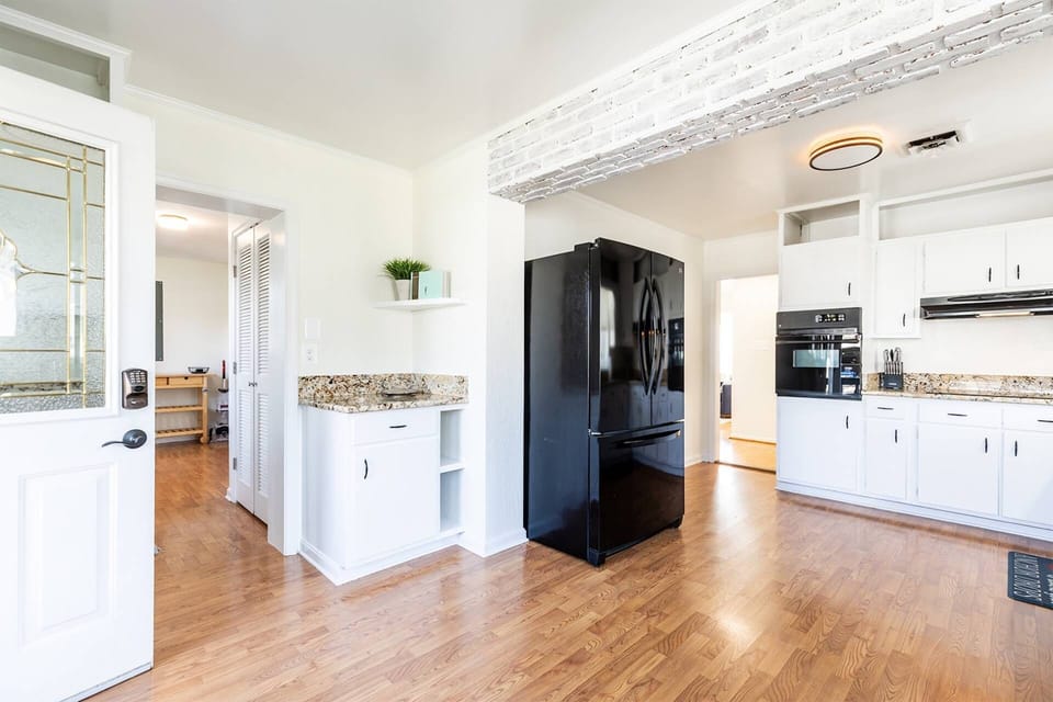 The kitchen is fully stocked with enough counter space, cookware and dining ware to prepare a big family meal.