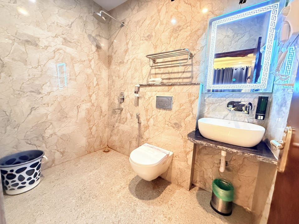 Deluxe Double Room, City View | Bathroom | Shower, free toiletries, hair dryer, slippers