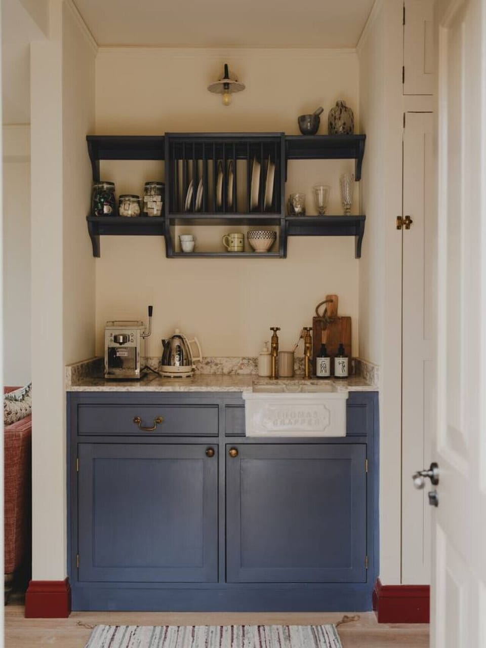 Compact kitchenette with Dualit appliances and Grind coffee machine for relaxed mornings