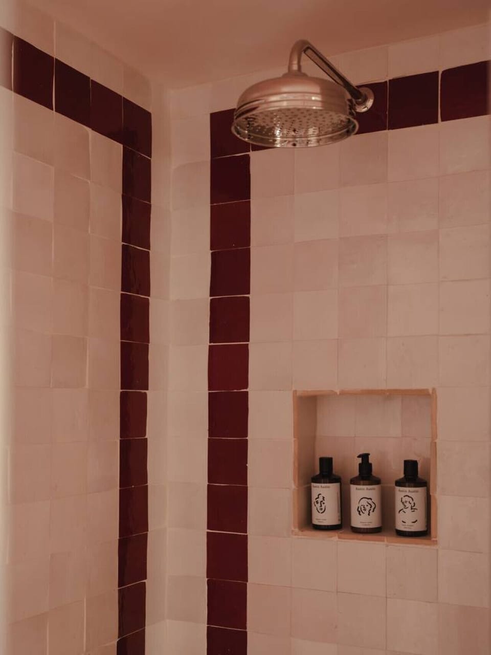 Walk-in shower with Austin Austin organic shampoo, conditioner and body wash