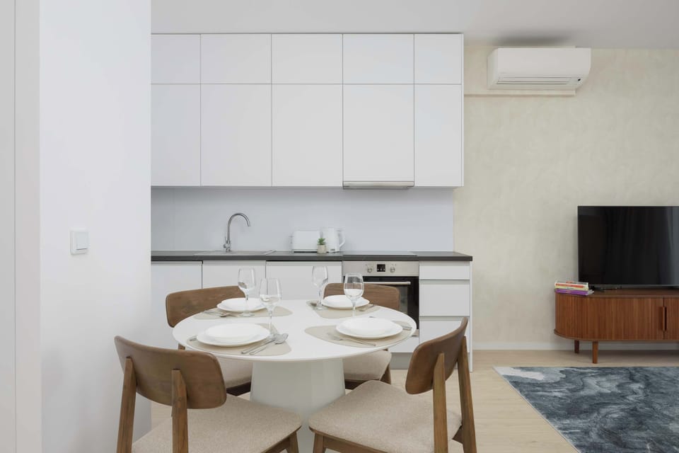 The living room's modern and stylish decor creates a welcoming atmosphere.
