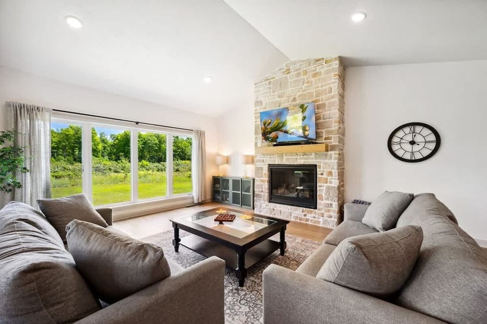 Relax in a clean and comfortable living area with peaceful orchard views just outside your window.