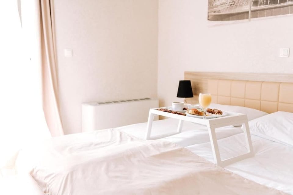 Superior Double Room, Balcony, Courtyard View | In-room safe, laptop workspace, blackout drapes, iron/ironing board