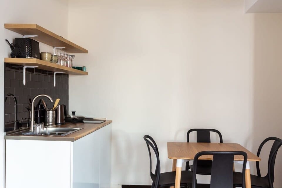 The dining table for four is perfect for shared meals or board games.