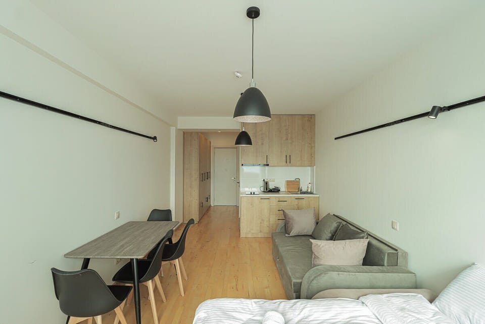 Experience the comfort of our thoughtfully designed studio, where every essential is conveniently within arm's reach. From the fully equipped kitchen to the cozy living area, everything you need is easily accessible, ensuring a seamless and relaxing 