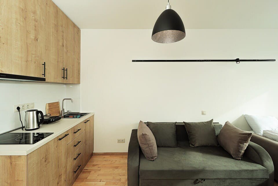 Our well-appointed kitchen offers all the amenities for a seamless stay, including complete dishes and silverware, a kettle, refrigerator, stove, toaster, and additional kitchen essentials. Whether you're brewing your morning coffee or cooking a hear