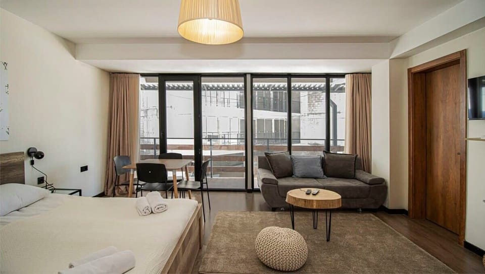 Smooth hardwood floors keep the room feeling fresh and neat.
