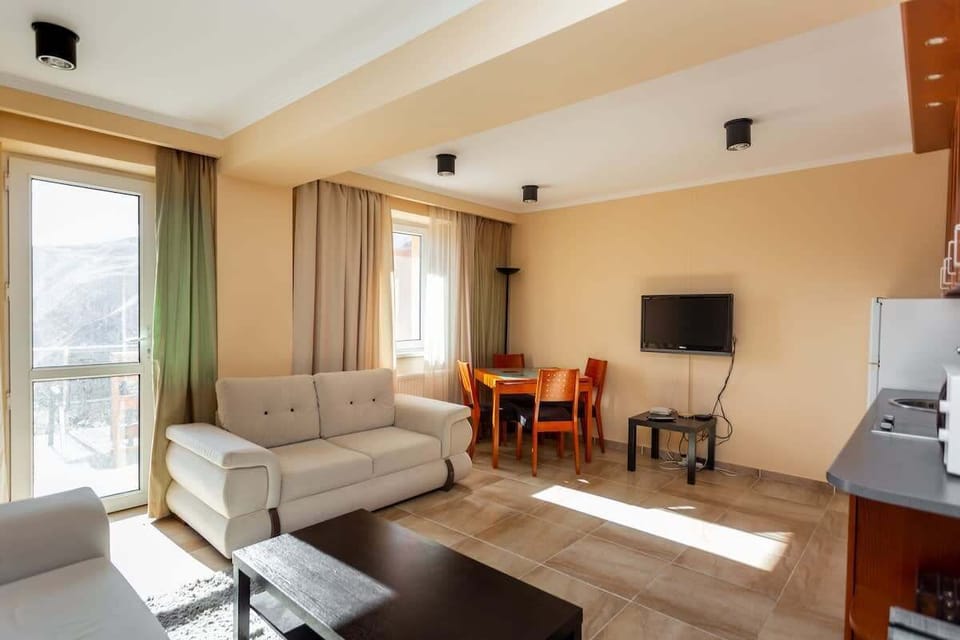 The living area is painted with a soft color palette for a calm atmosphere.