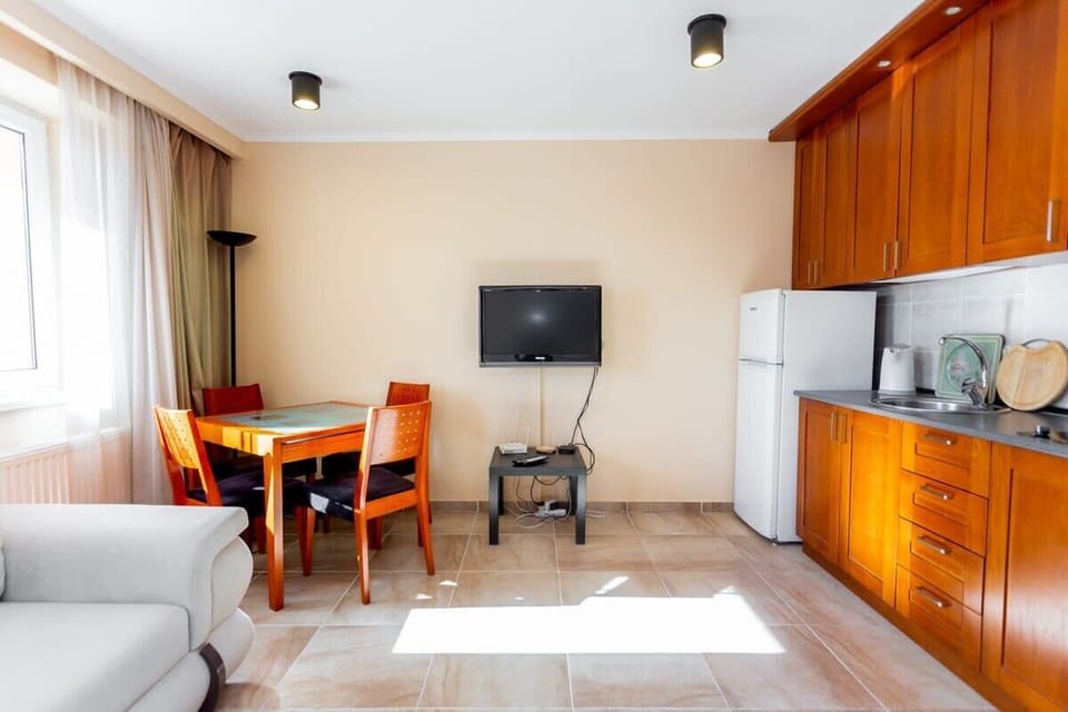 The open layout connects the living area to the kitchen.