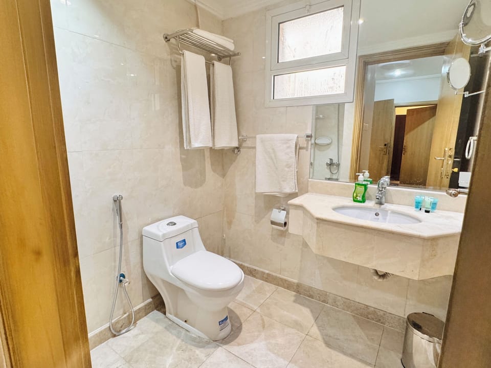 Combined shower/tub, hair dryer, towels, soap