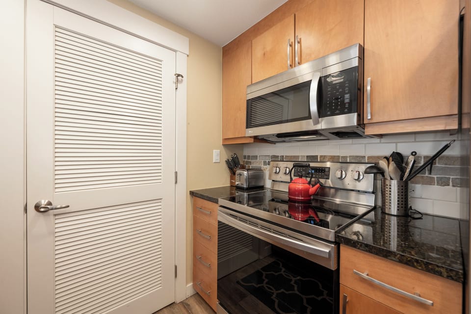 Your modern kitchen awaits with granite countertops, stainless steel appliances, and everything you need for memorable meals.