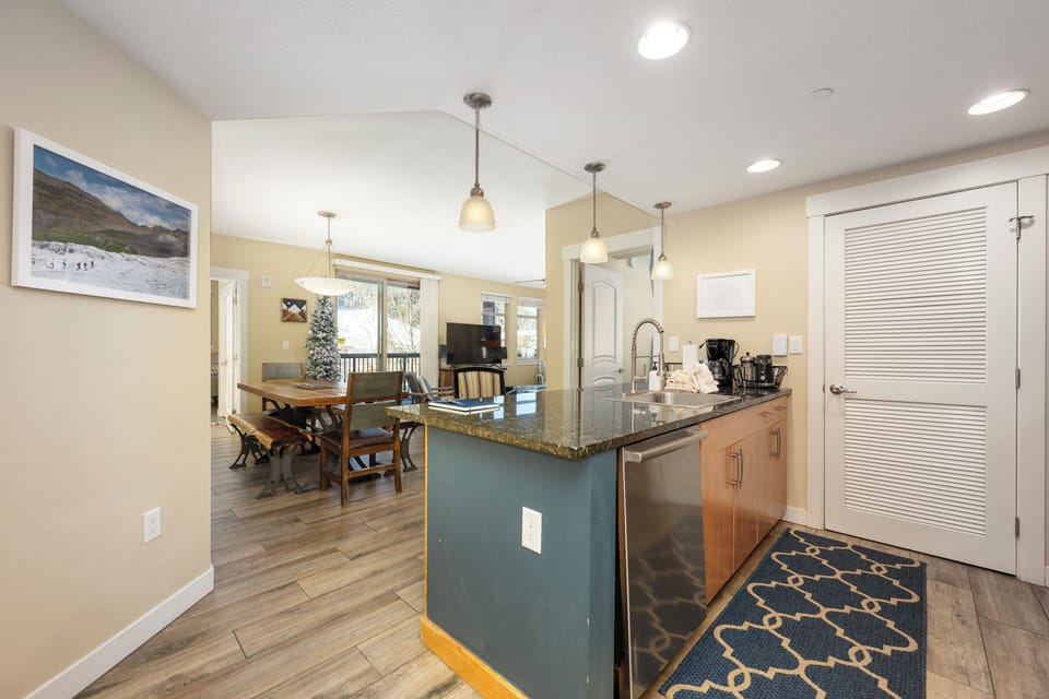 Your open-concept kitchen flows seamlessly into the dining area, creating the perfect space for cooking and gathering with loved ones.