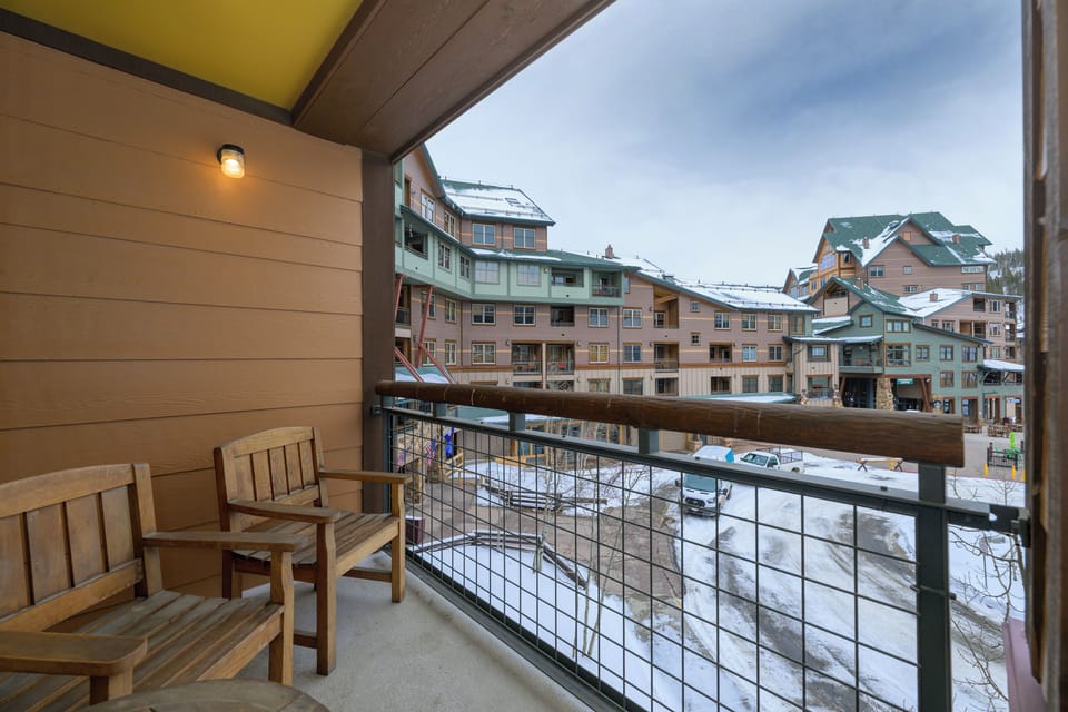 Step onto your private balcony and breathe in the crisp mountain air while overlooking the charming snow-dusted village below.