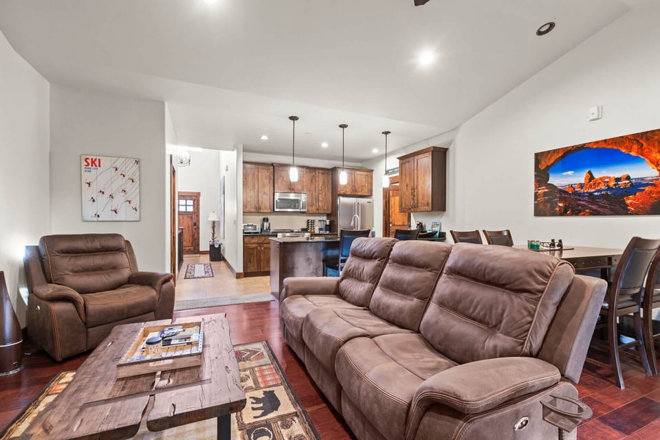 Relax on plush seating in your open-concept main level living space, where mountain views and ski memories blend perfectly with modern comfort.