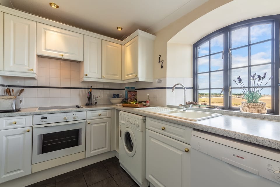First floor: The kitchen is well-equipped and bright