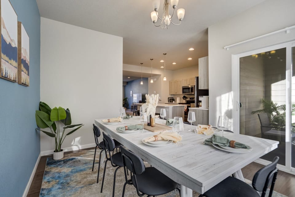 Bright and welcoming dining room with the private balcony just off it!