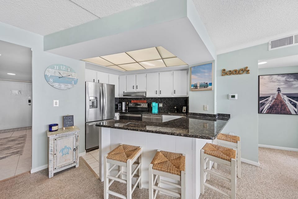 Gleaming granite countertops welcome you to this stunning kitchen!