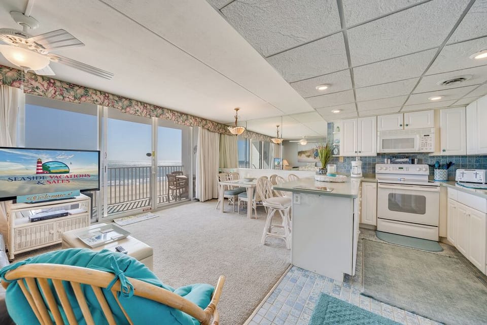 Enjoy the Sunrise from a comfy chair or glide outside to breathe in the Salty Air!