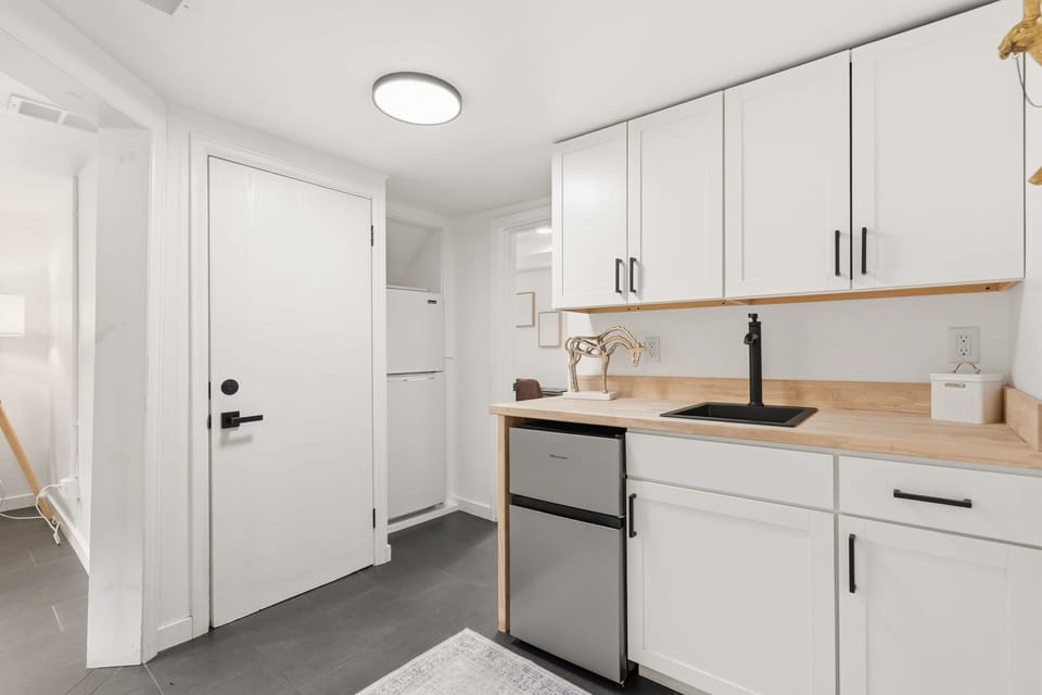 Kitchenette | Wet Bar with Sink, Mini Fridge and Full-sized Fridge (lower level)