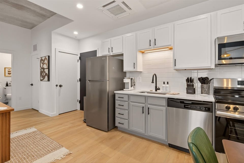 Everything you need: pots, pans, seasonings, rice cooker, coffee, and electric kettle. Just bring groceries. 