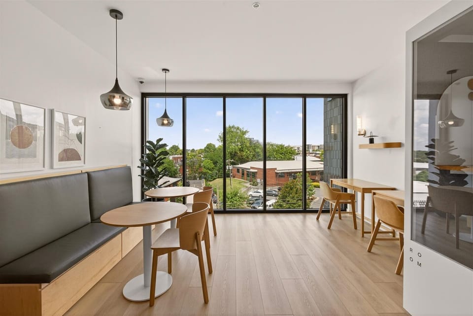 Soak in the natural light and skyline views in this modern co - working space, complete with a private pod.