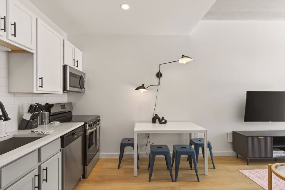 Open-concept flow from kitchen to dining to living—for casual meals, work-from-home days, or kicking back for a show.