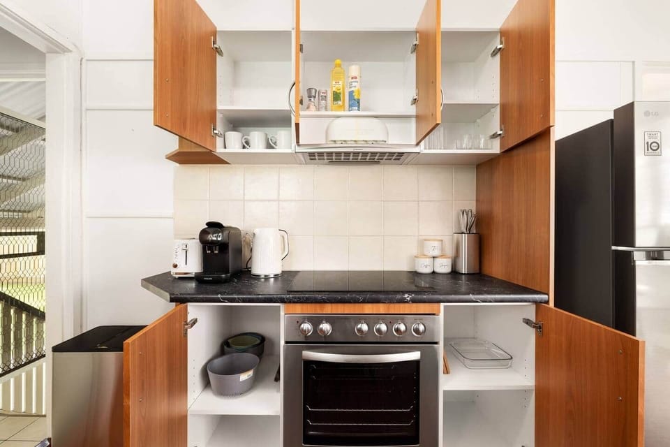 Kitchen: Sleek kitchen with ample storage, modern appliances
