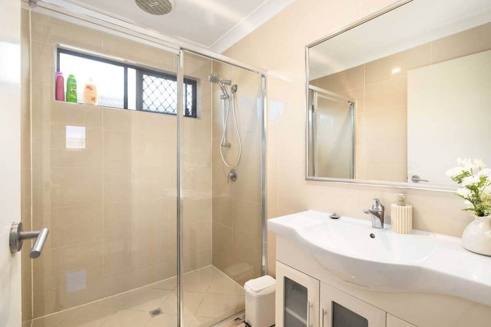Bathroom: Stylish bathroom with walk-in shower, vanity, and clean finishes 