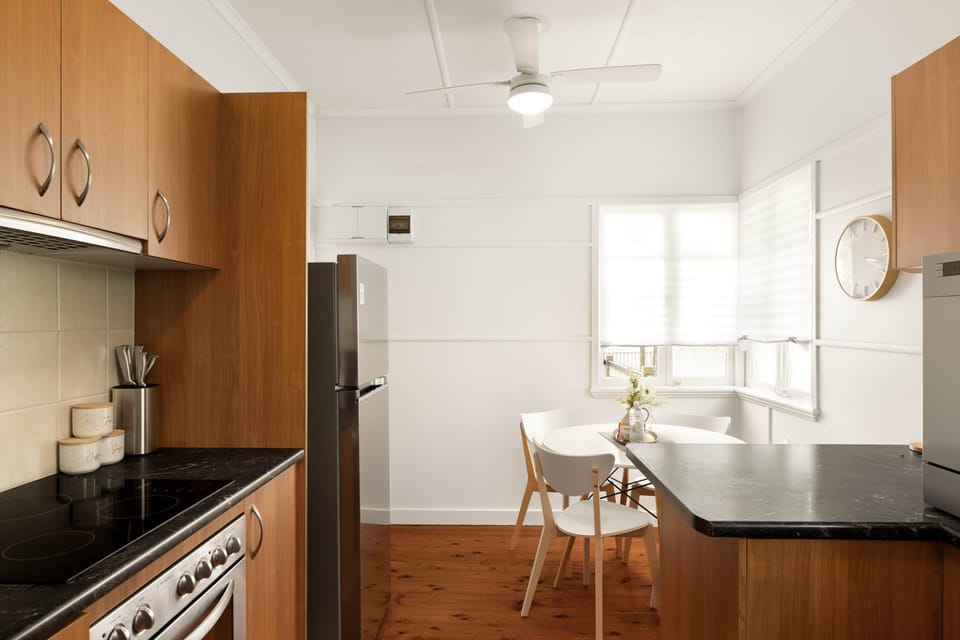 Kitchen: Sleek kitchen with ample storage, modern appliances