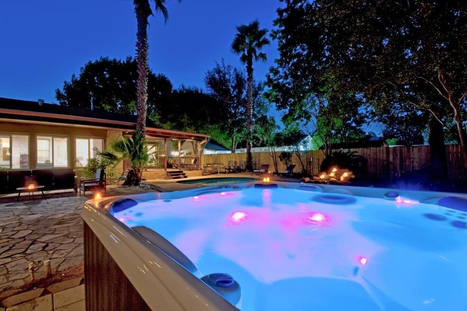 A backyard oasis with a luxury Hot Tub festive layout.