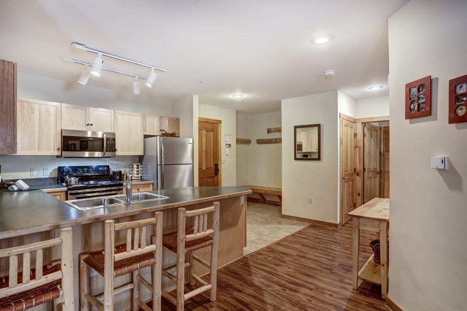 The full kitchen is equipped with modern appliances, making it easy to prepare meals for family and friends.