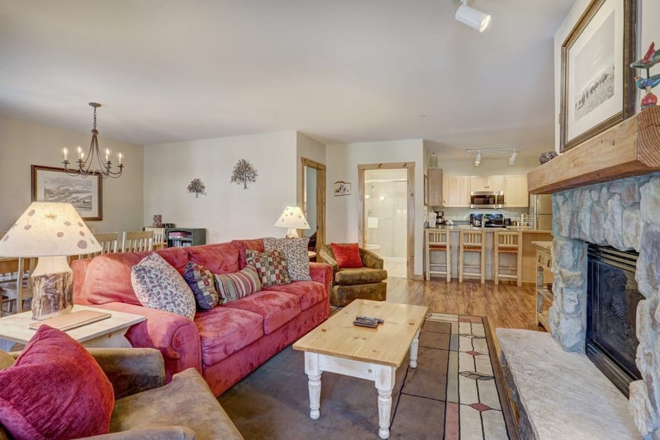 The open layout showcases both comfort and style, featuring a well-appointed kitchen visible from the cozy living space.