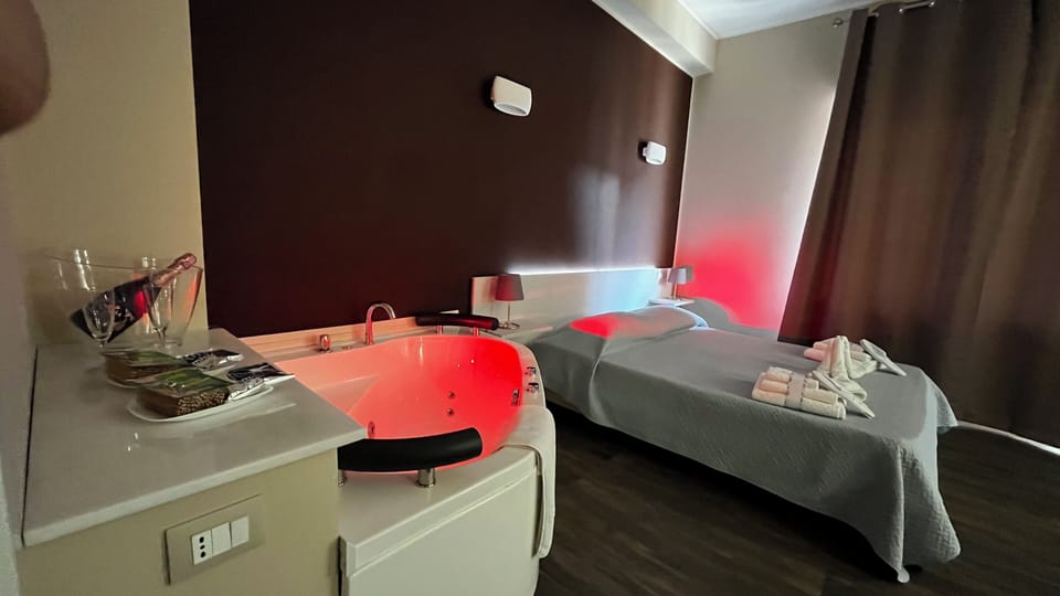 Suite, Balcony, City View | In-room safe, blackout drapes, iron/ironing board, free WiFi