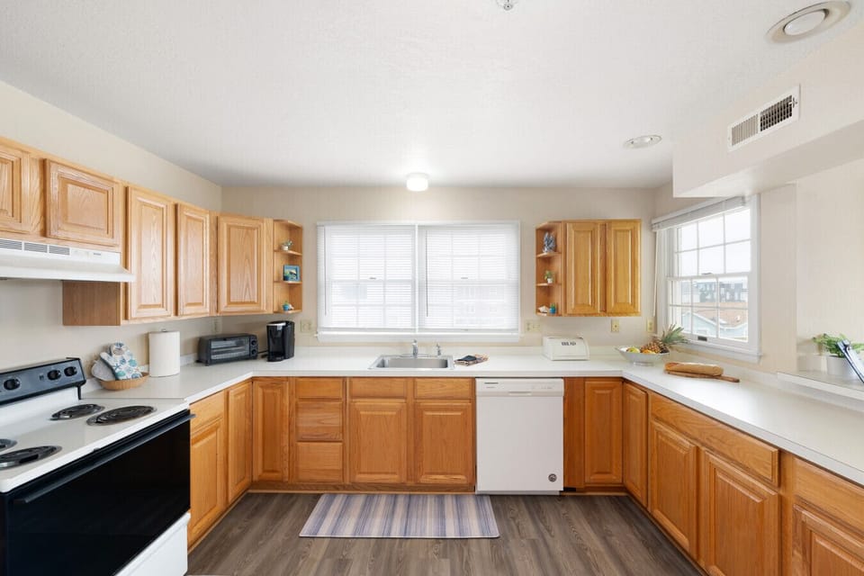 Full kitchen with dishwasher, microwave, and plenty of counter space.