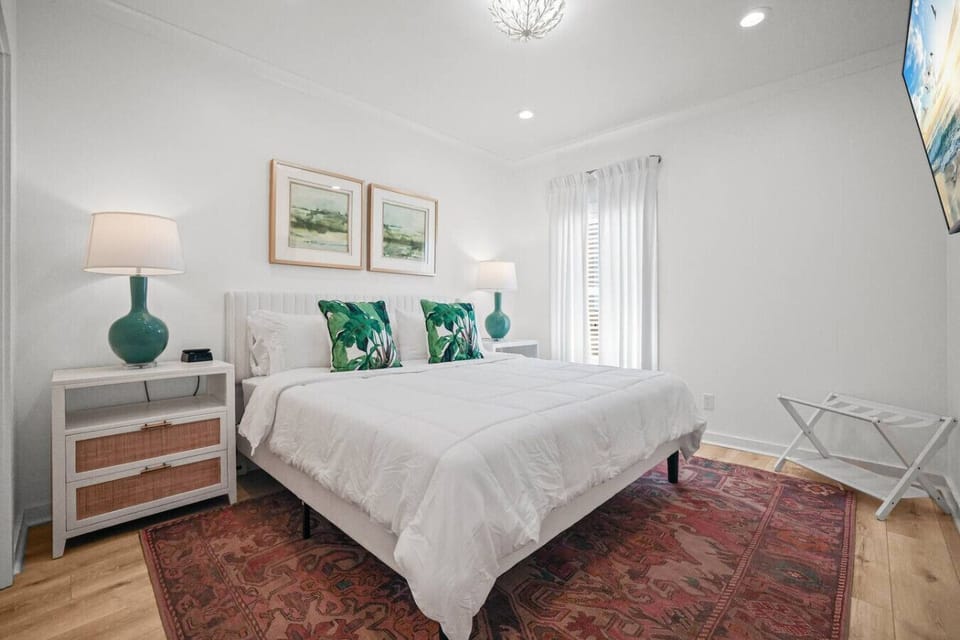 Well-appointed primary bedroom — Fresh linens and ample storage