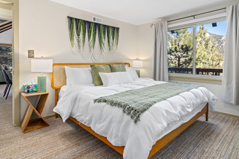 Wake up to sweeping mountain views right from king bed