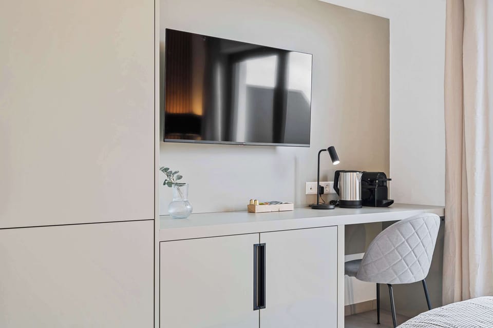 Desk space with a coffee maker and kettle for added convenience.