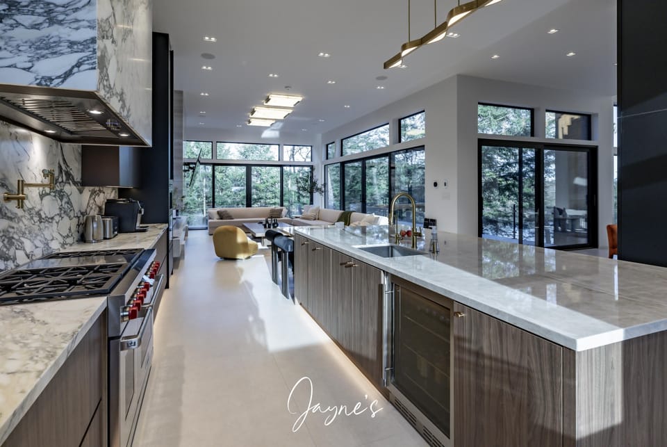 Sleek modern kitchen with expansive island and natural light